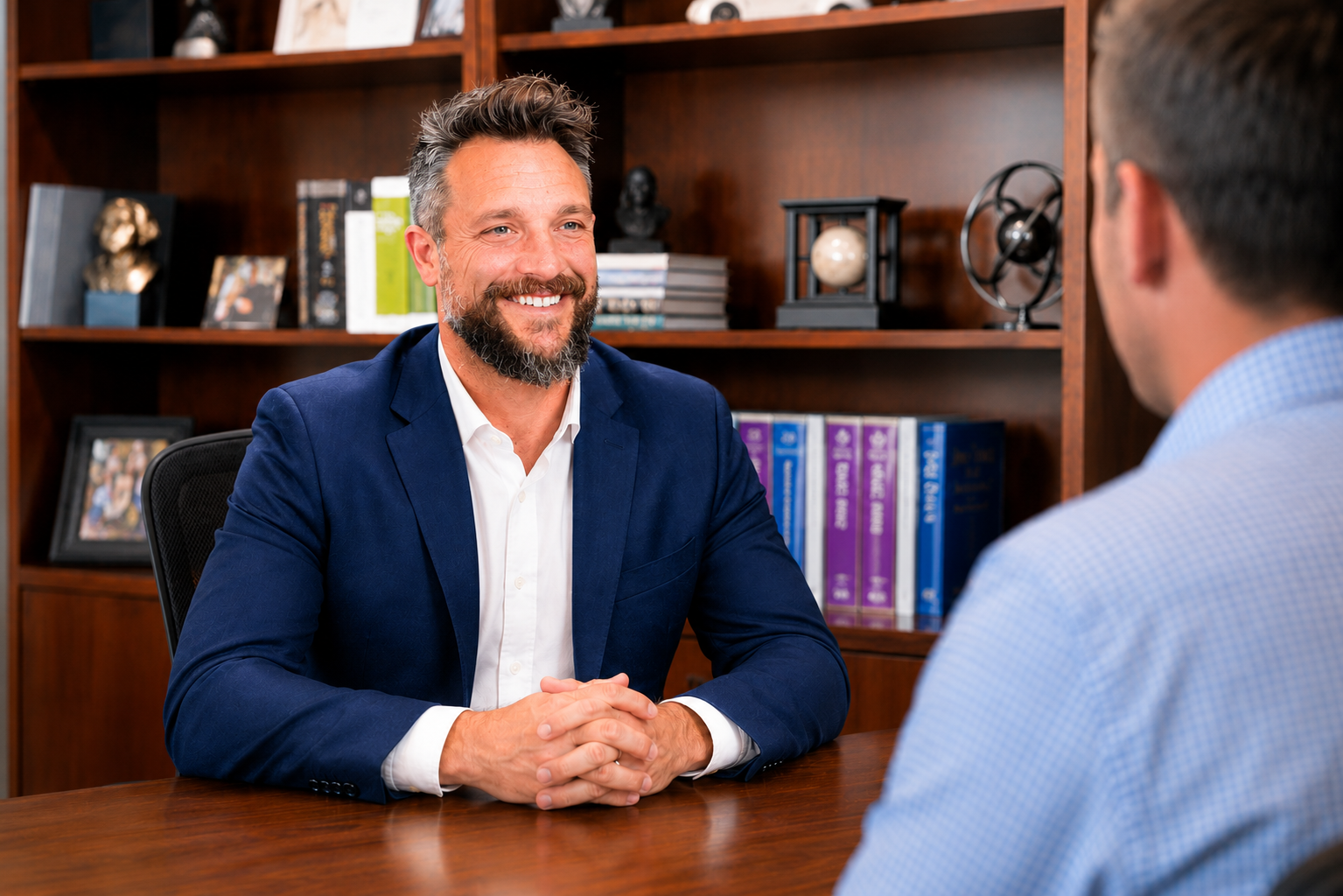 Daniel Rohr in an advisory conversation with a client across the table.